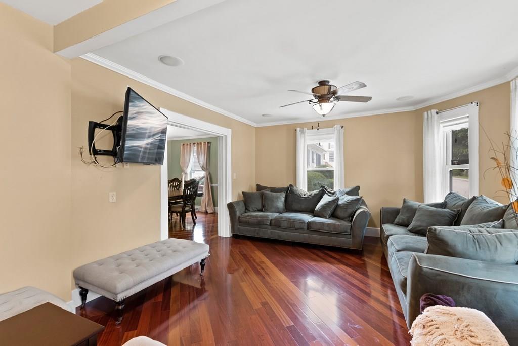 143 18th Street Lowell, MA 01850 - Photo 13 of 35 a living room with furniture and wooden floor