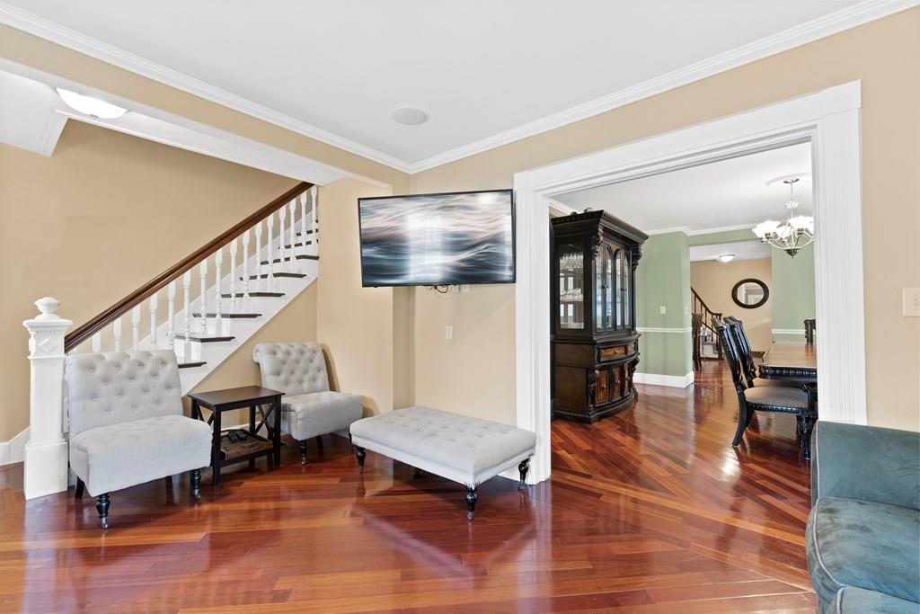 143 18th Street Lowell, MA 01850 - Photo 14 of 35 a living room with furniture and wooden floor