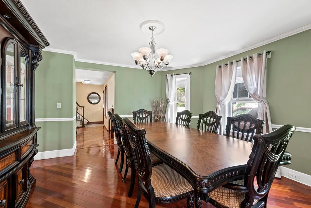 143 18th Street Lowell, MA 01850 - Photo 18 of 35 a view of a dining room with furniture window and wooden floor