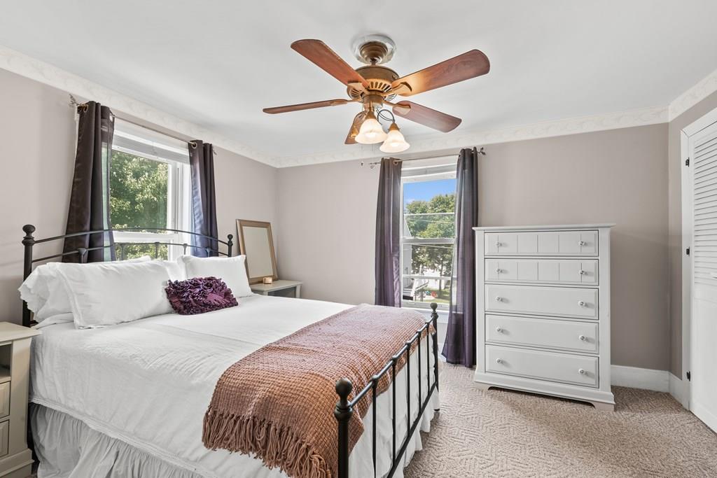 143 18th Street Lowell, MA 01850 - Photo 24 of 35 a bedroom with a bed a dresser and a window