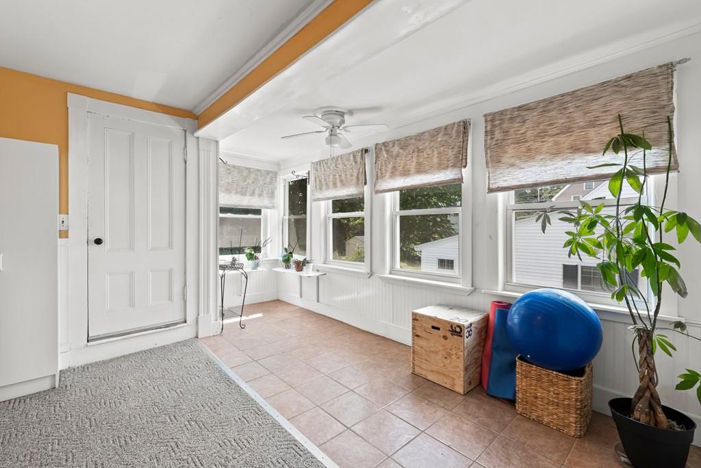 143 18th Street Lowell, MA 01850 - Photo 29 of 35 a living room with furniture and a potted plant