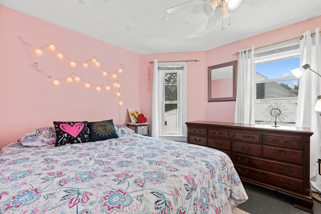 143 18th Street Lowell, MA 01850 - Photo 33 of 35 a bedroom with a bed and a dresser