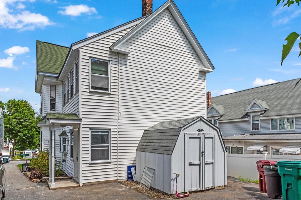 143 18th Street Lowell, MA 01850 - Photo 6 of 35 a view of a back yard of the house