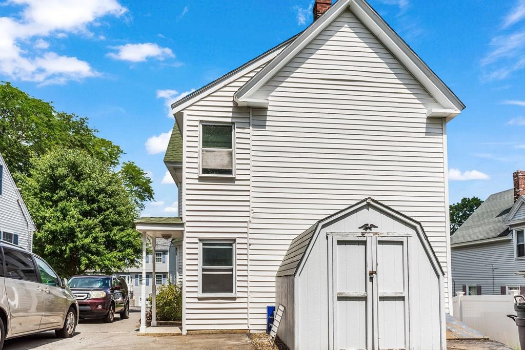 143 18th Street Lowell, MA 01850 - Photo 7 of 35 a view of a white house with a white door