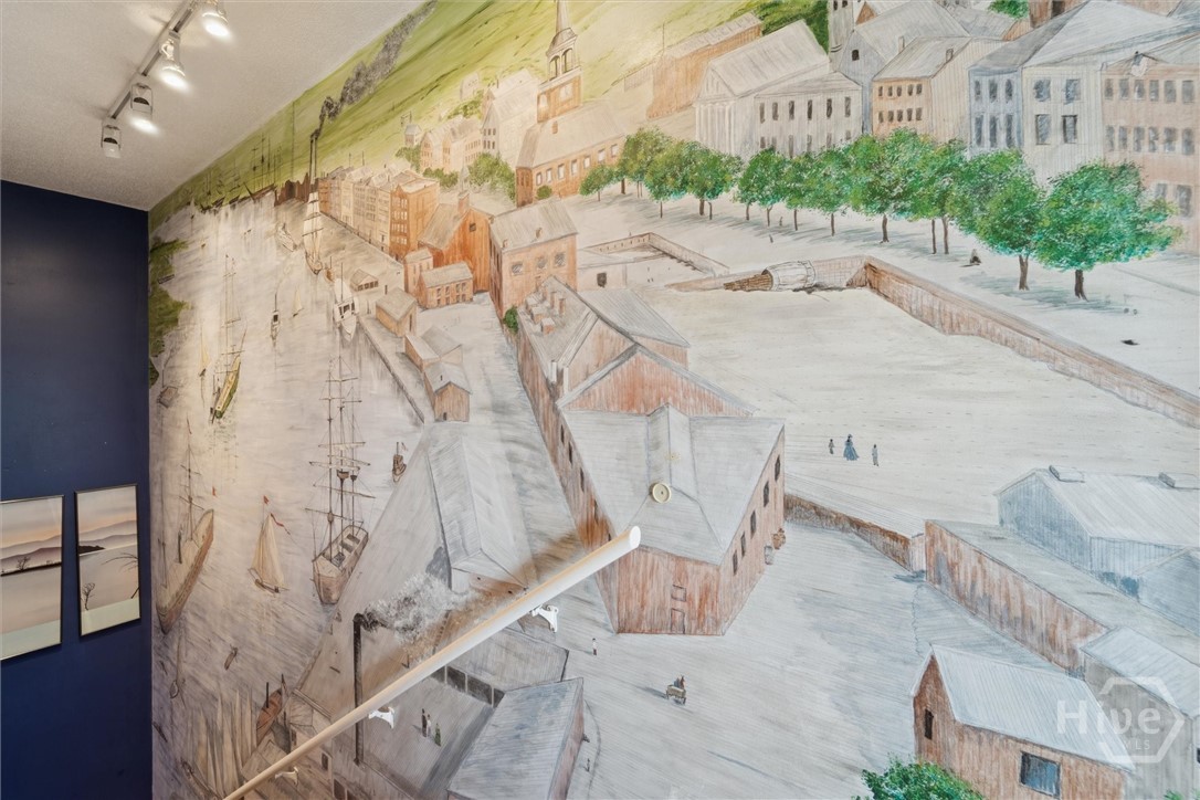 12502 Apache Avenue, Unit 38 Savannah, GA 31419 - Photo 17 of 45 Savannah's historic waterfront is displayed in the stairway.