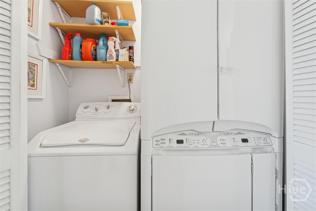 12502 Apache Avenue, Unit 38 Savannah, GA 31419 - Photo 30 of 45 In the hallway between both bedrooms is the laundry room. Washer and dryer remain with the unit.