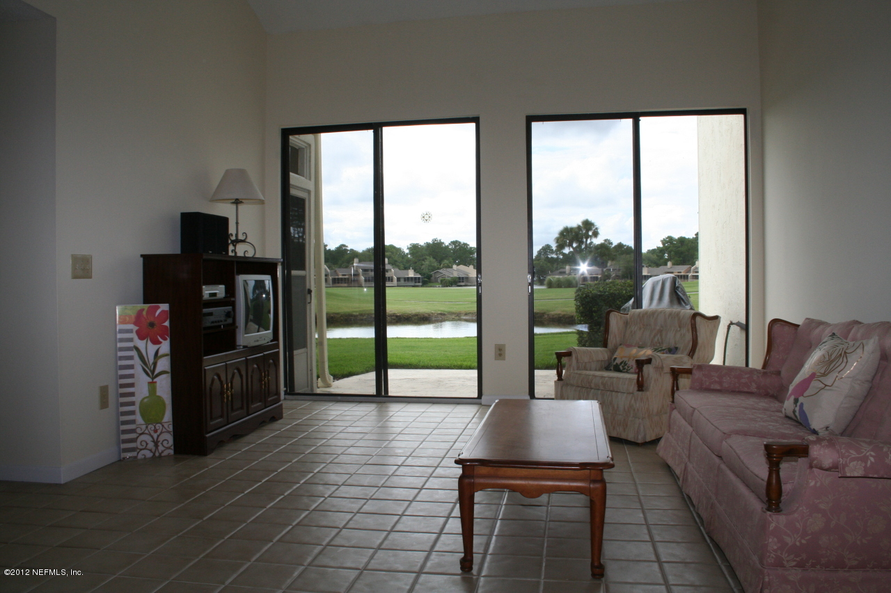 8 Cove Road Ponte Vedra Beach, FL 32082 - Photo 13 of 19 family room with water & golf views