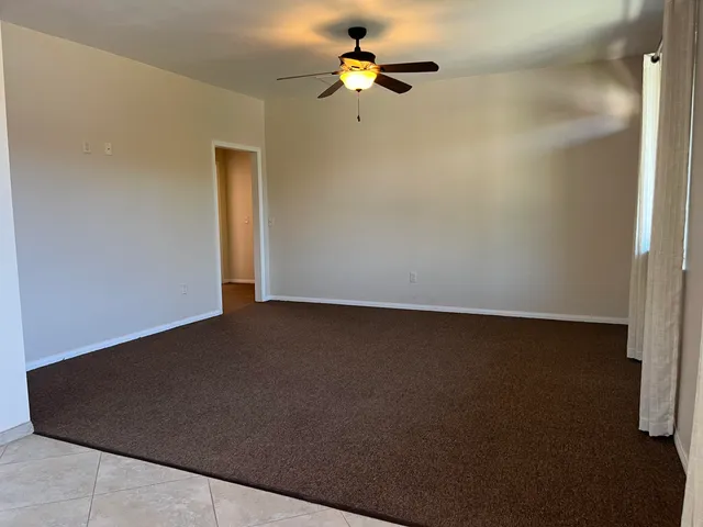 a kitchen with granite countertop a sink and a window