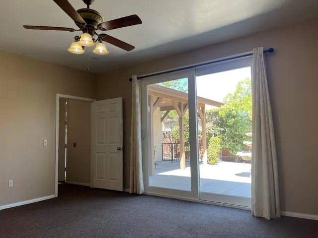 a view of empty room with large windows