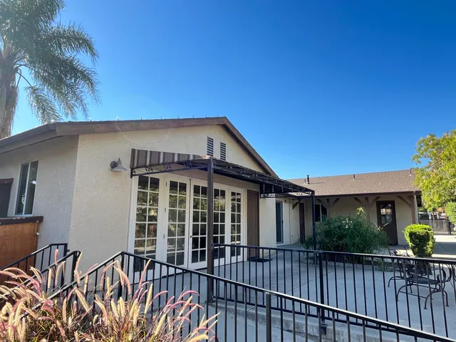 a view of a backyard with a fence