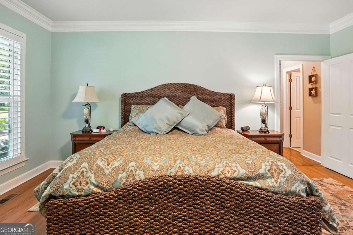 202 Vassar Point Drive St. Simons, GA 31522 - Photo 41 of 62 a bedroom with a bed and a window