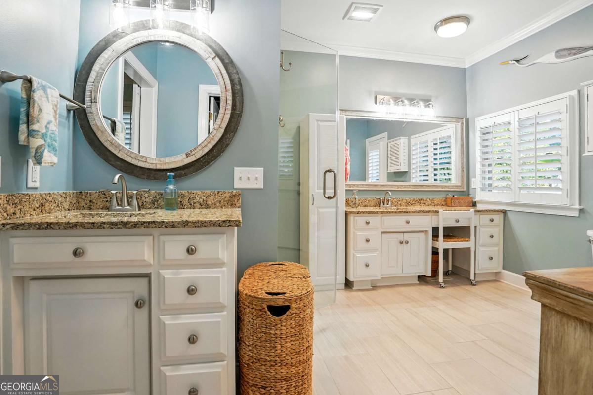 202 Vassar Point Drive St. Simons, GA 31522 - Photo 43 of 62 a view of a kitchen with cabinets and a wooden floor