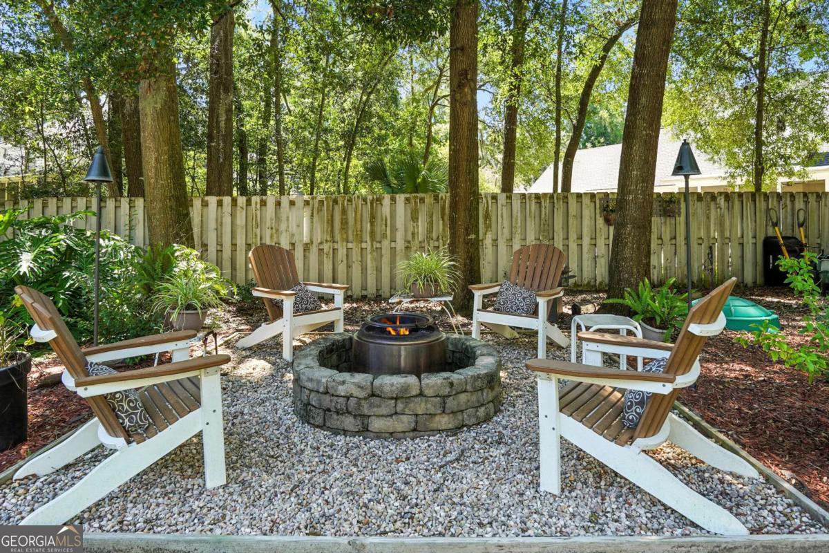 202 Vassar Point Drive St. Simons, GA 31522 - Photo 47 of 62 a view of a patio with couches chairs and a potted plant
