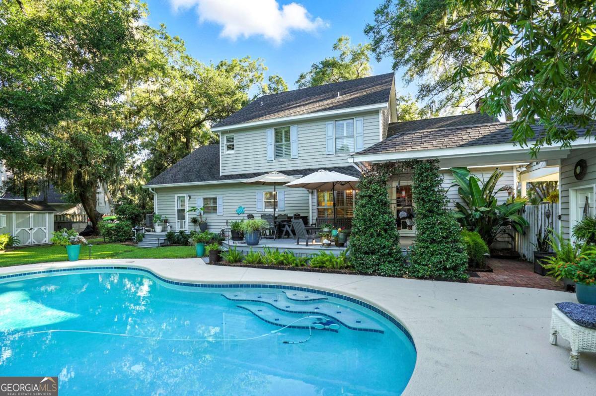 202 Vassar Point Drive St. Simons, GA 31522 - Photo 49 of 62 a front view of a house with a yard table and chairs