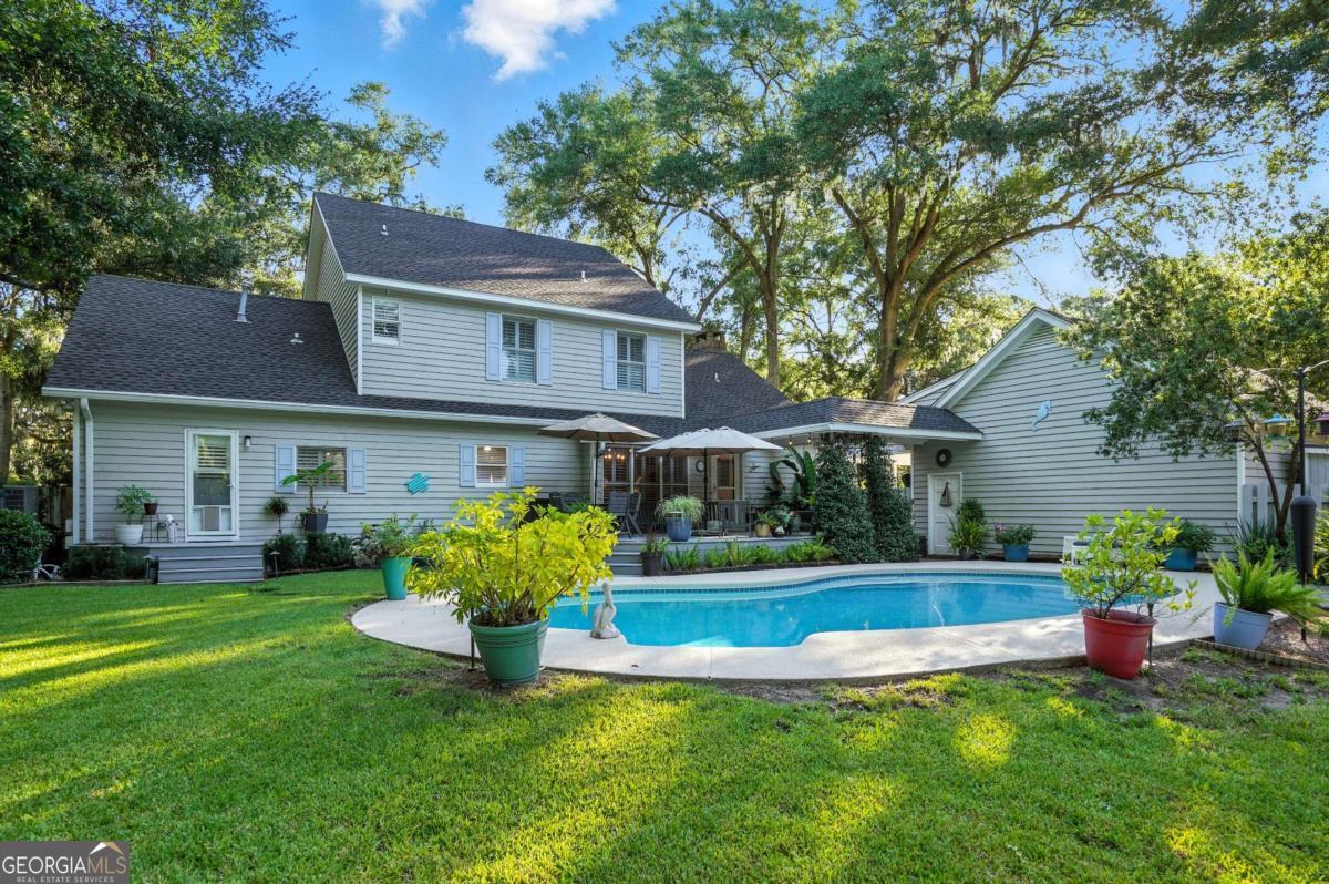 202 Vassar Point Drive St. Simons, GA 31522 - Photo 51 of 62 a view of a house with a yard porch and sitting area