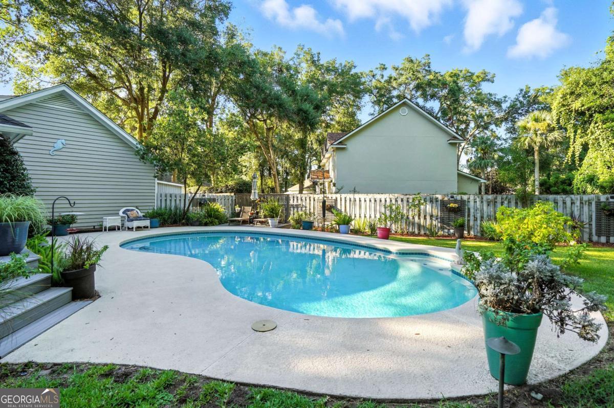 202 Vassar Point Drive St. Simons, GA 31522 - Photo 54 of 62 a view of swimming pool with a patio