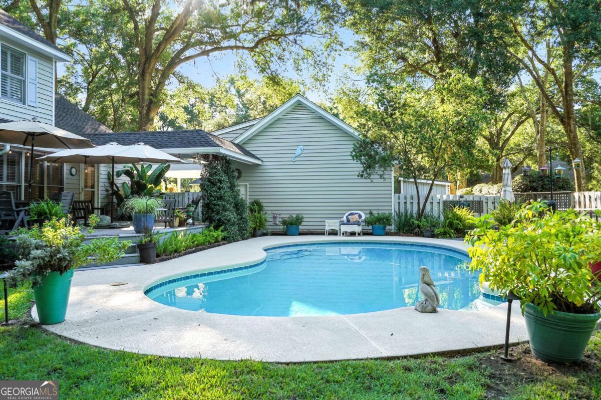 202 Vassar Point Drive St. Simons, GA 31522 - Photo 55 of 62 a view of a house with a yard and sitting area