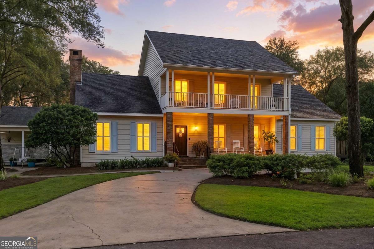 202 Vassar Point Drive St. Simons, GA 31522 - Photo 58 of 62 a front view of house with yard and green space