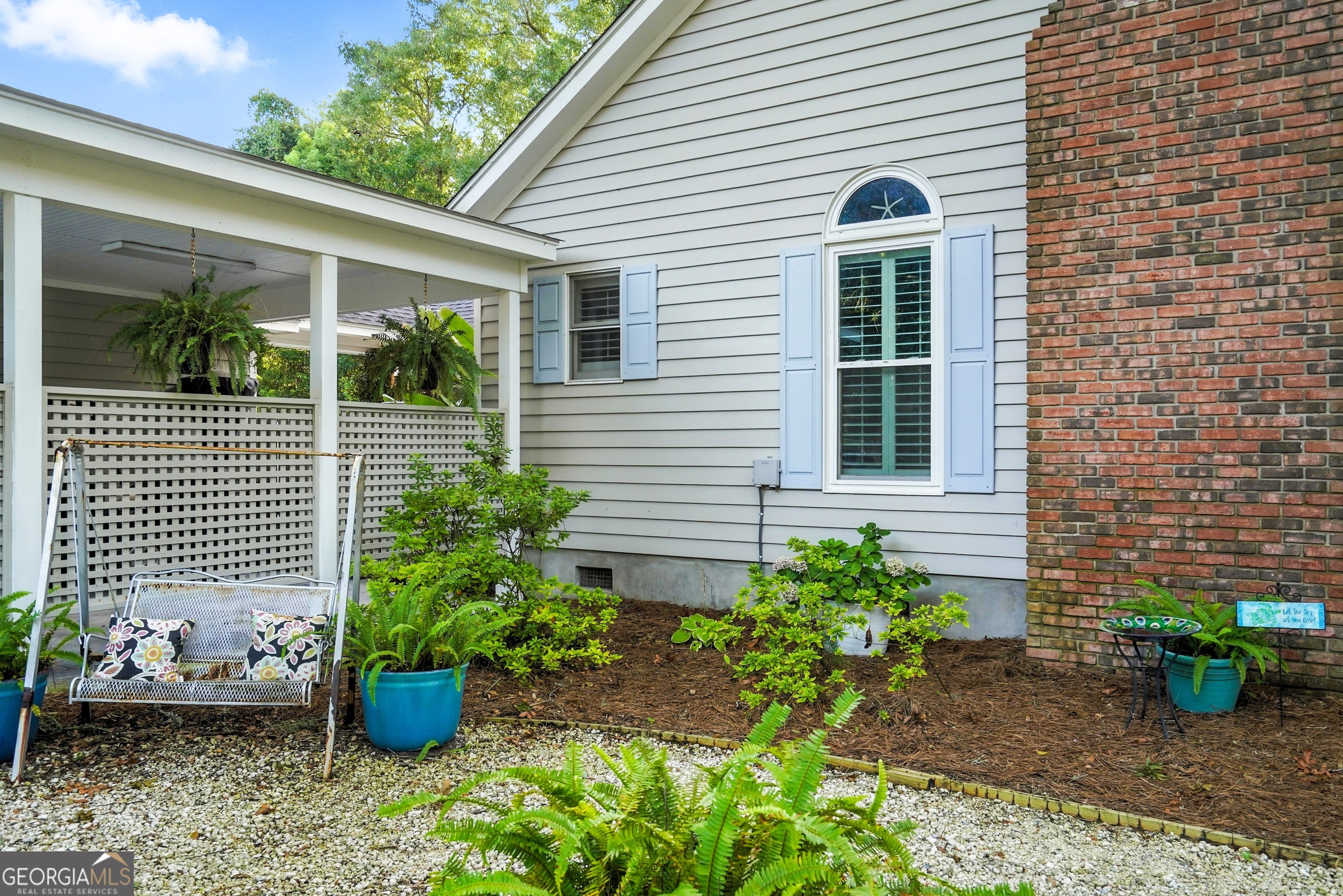 202 Vassar Point Drive St. Simons, GA 31522 - Photo 61 of 62 a view of a backyard with potted plants