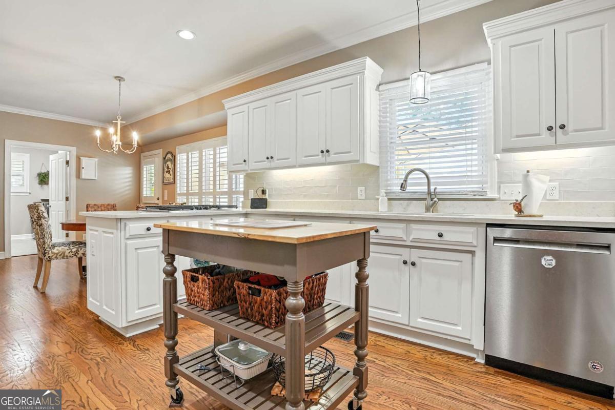 202 Vassar Point Drive St. Simons, GA 31522 - Photo 8 of 62 a kitchen with a sink cabinets and window