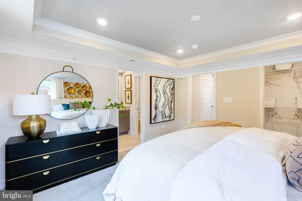 a bedroom with a bed and a dresser