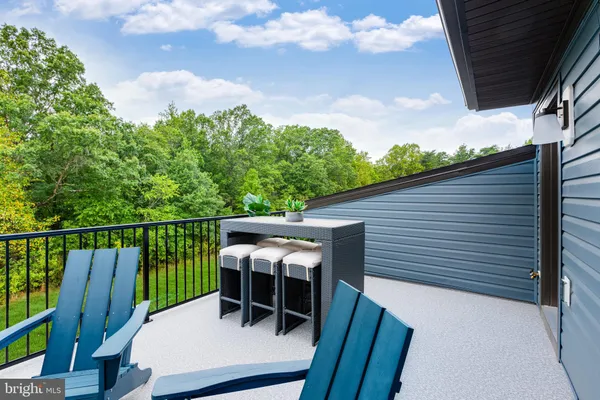 a view of a balcony with furniture