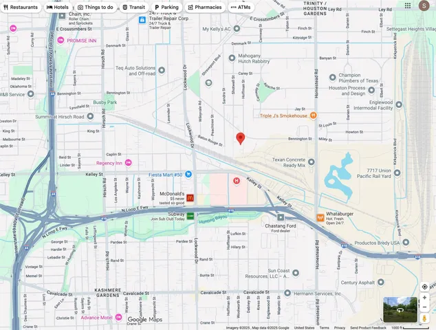 a white and black umbrella sitting in a backyard