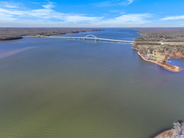 a view of a lake with a yard