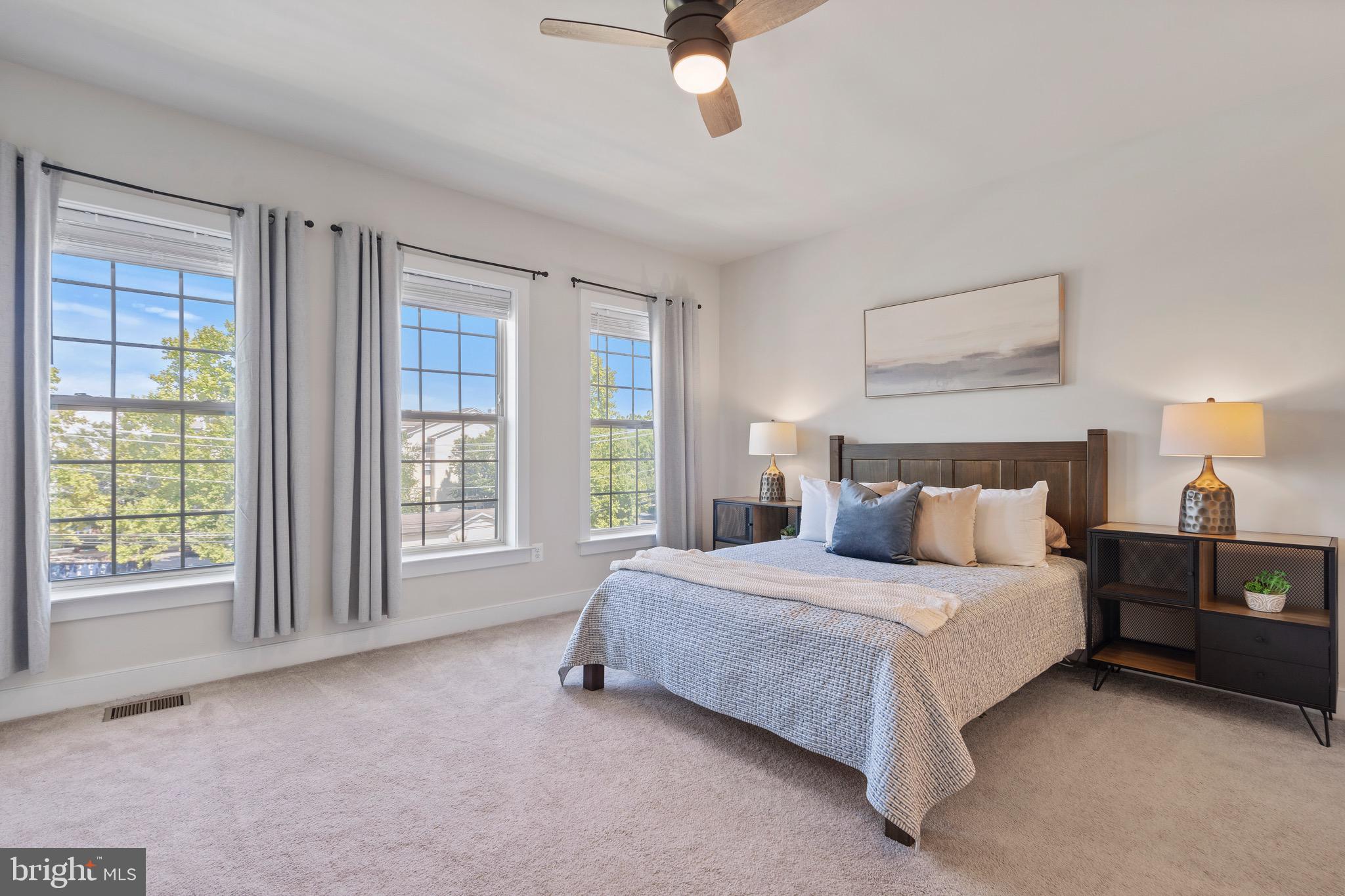 9580 Fields Road Gaithersburg, MD 20878 - Photo 20 of 58 a spacious bedroom with a bed and a large window