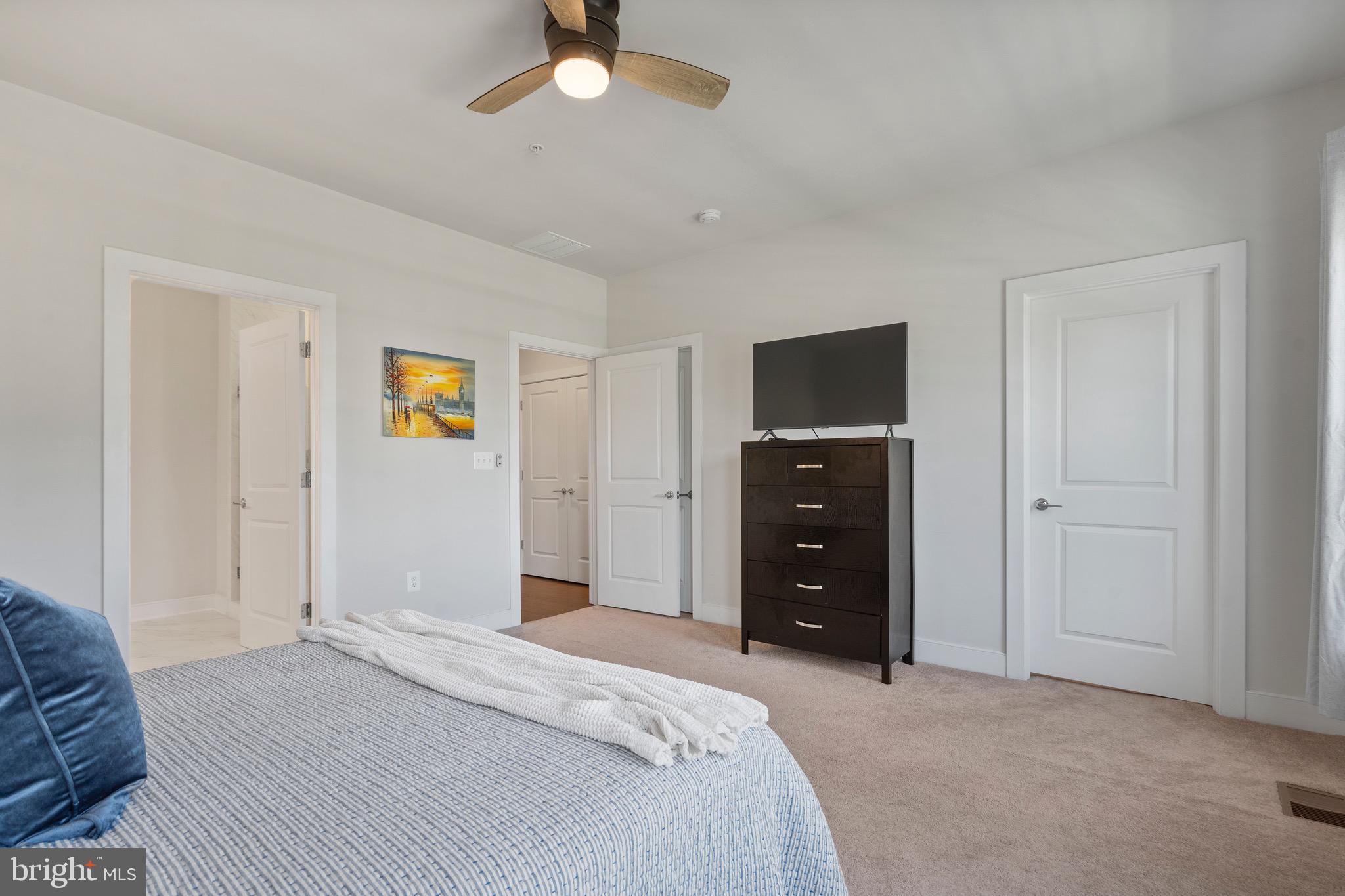 9580 Fields Road Gaithersburg, MD 20878 - Photo 22 of 58 a bedroom with a bed and a tv