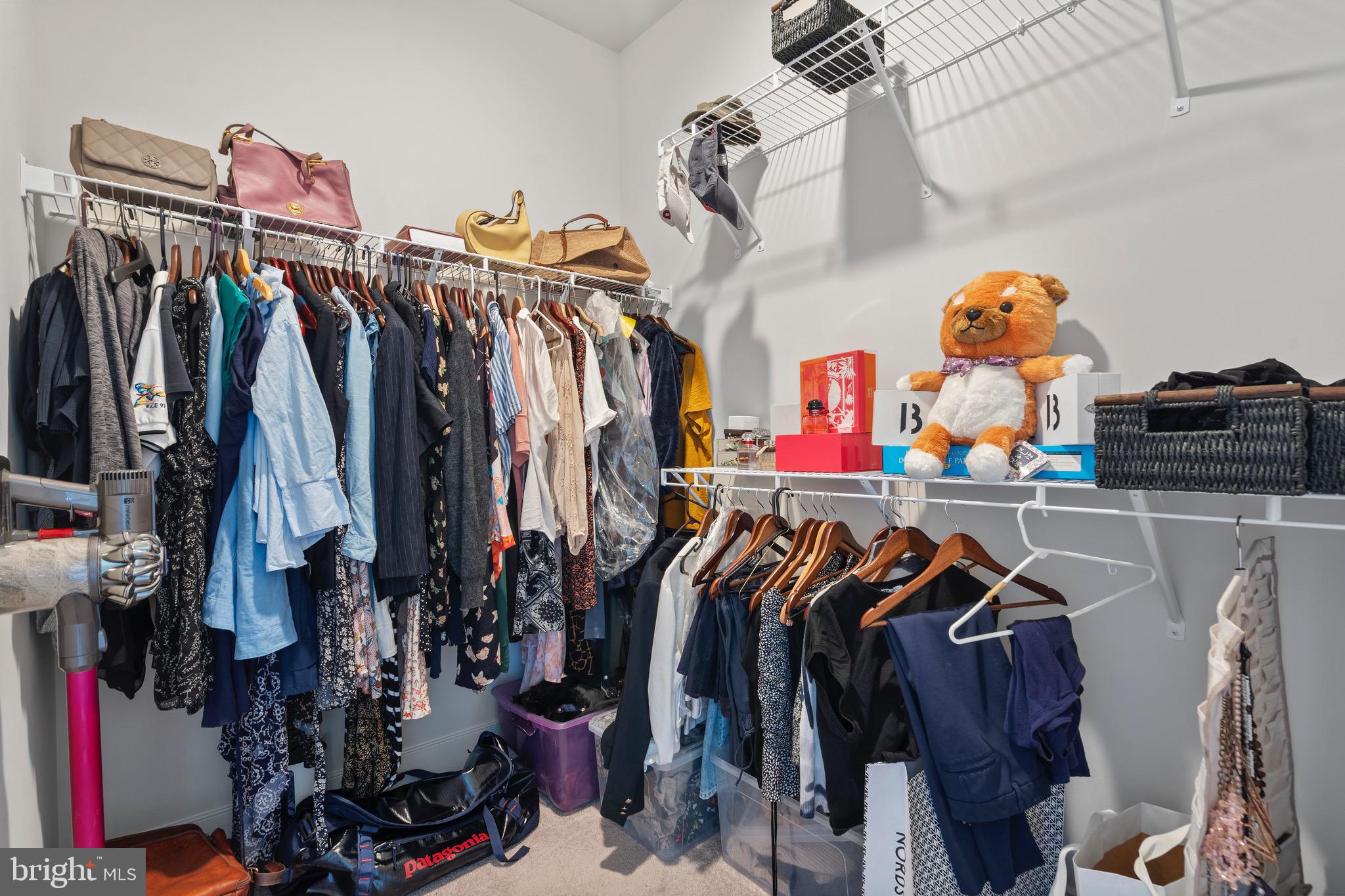 9580 Fields Road Gaithersburg, MD 20878 - Photo 26 of 58 a view of walk in closet with clothes