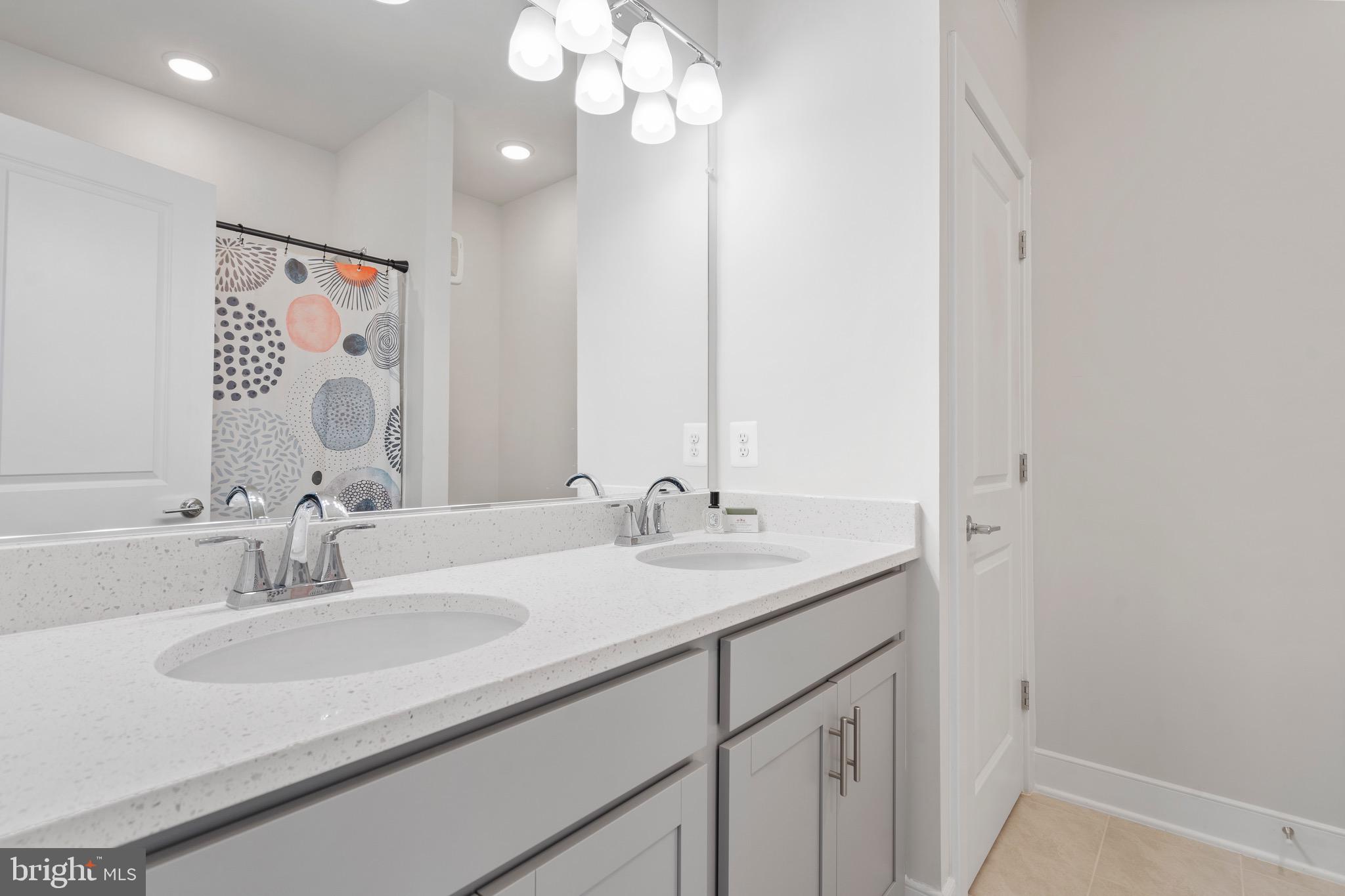 9580 Fields Road Gaithersburg, MD 20878 - Photo 28 of 58 a bathroom with a sink vanity and a mirror