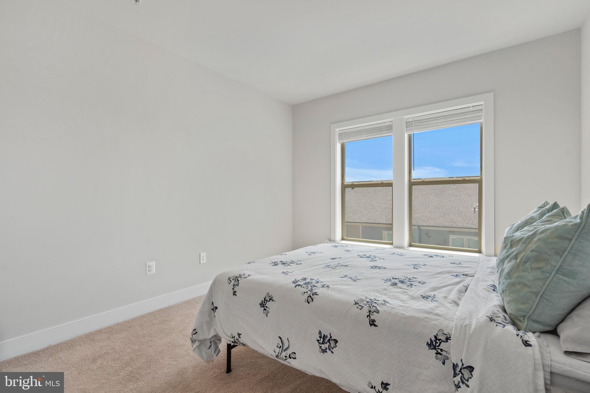 9580 Fields Road Gaithersburg, MD 20878 - Photo 31 of 58 a bedroom with a bed and a window