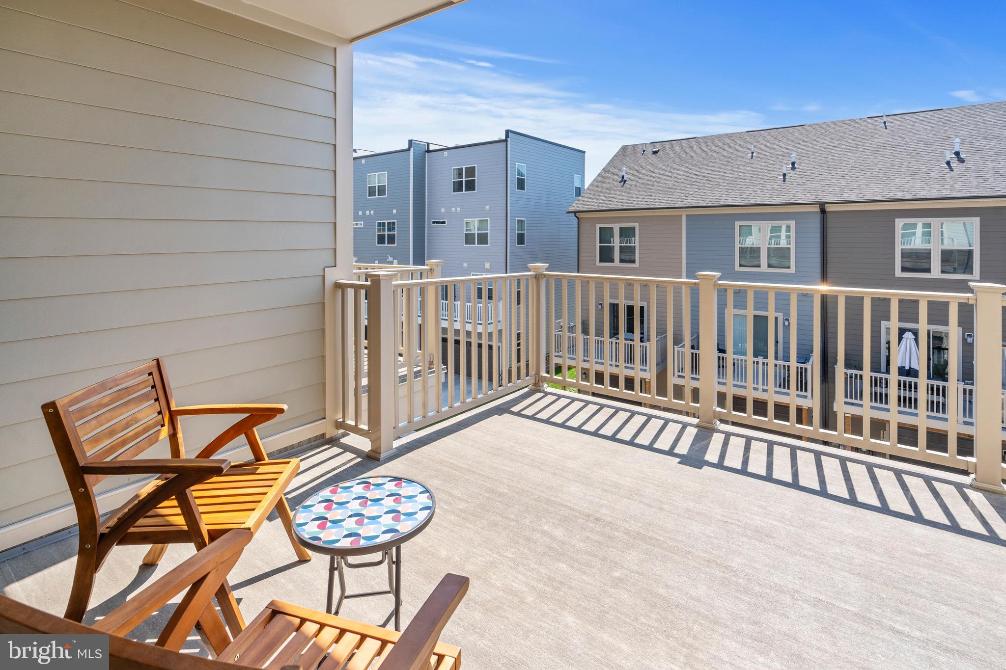 9580 Fields Road Gaithersburg, MD 20878 - Photo 38 of 58 a view of a chairs and table on the deck