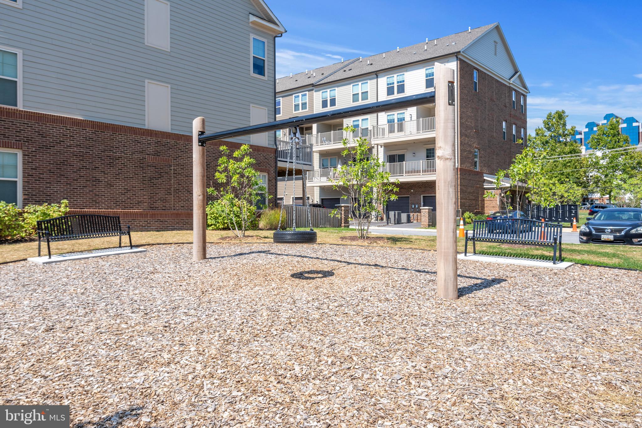 9580 Fields Road Gaithersburg, MD 20878 - Photo 42 of 58 a backyard of a house with table and chairs