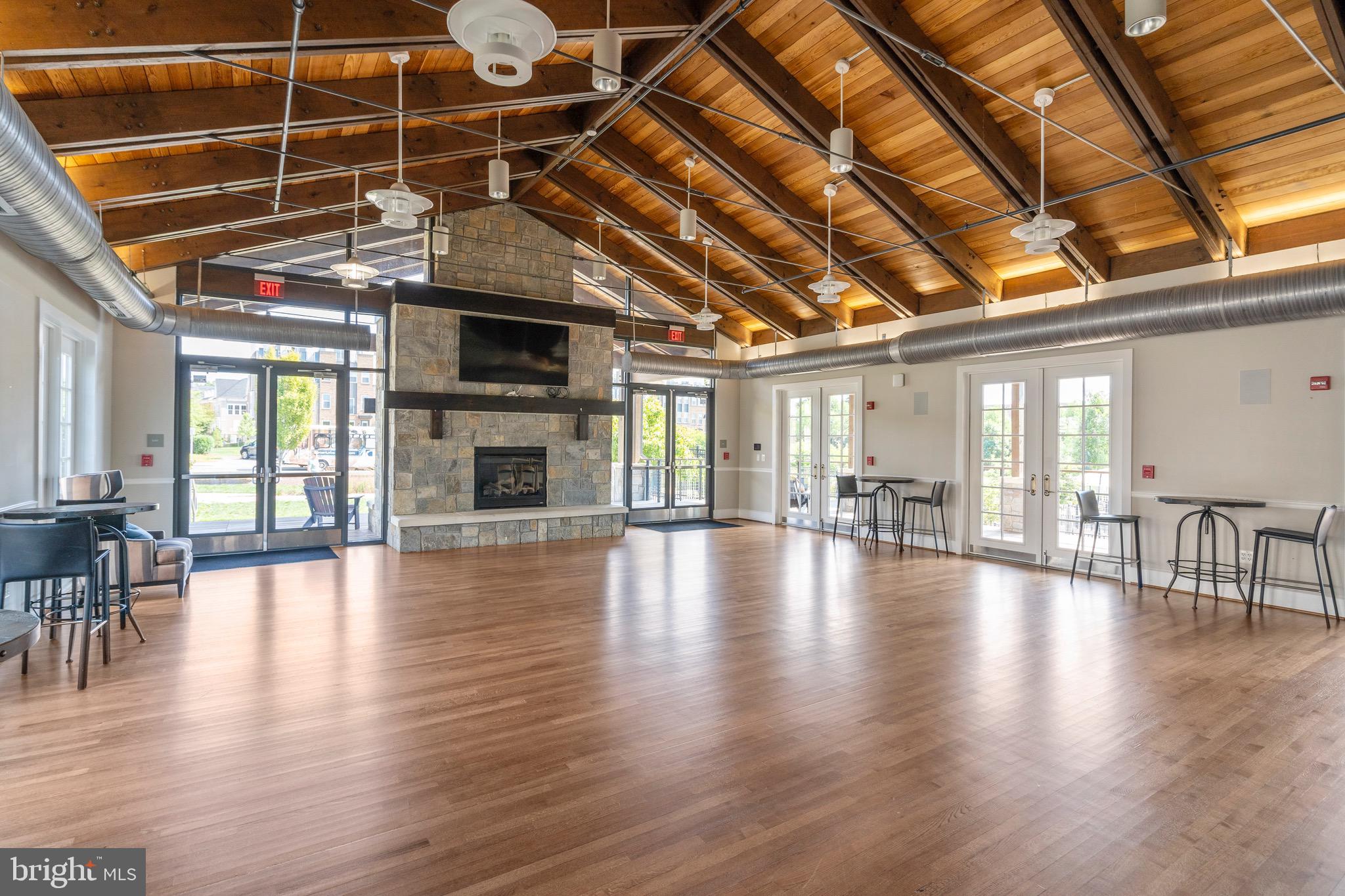 9580 Fields Road Gaithersburg, MD 20878 - Photo 48 of 58 a view of an empty room with wooden floor and a fireplace