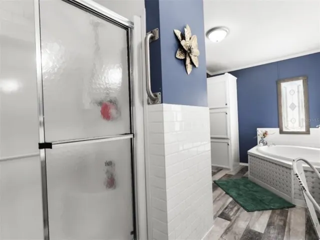a bathroom with a shower and a sink