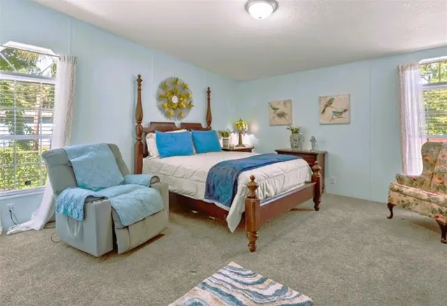 a bedroom with a bed and a couch