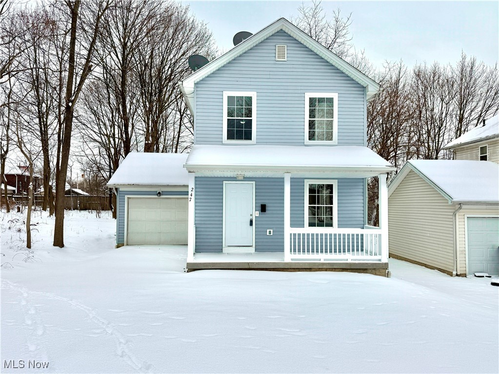 247 Reed Avenue Campbell, OH 44405 - Photo 41 of 41 View of front of property with a garage and a porch