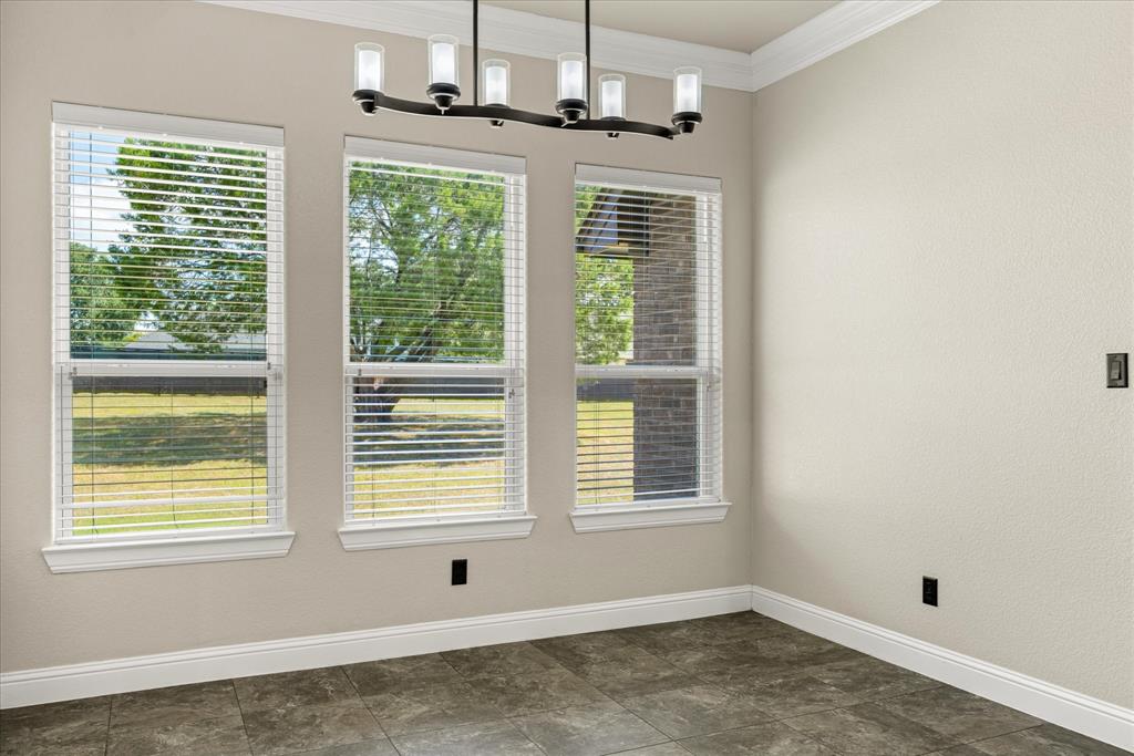 3711 Lonesome Creek Road Granbury, TX 76049 - Photo 11 of 39 Great views from kitchen and dining room of the backyard...can you envision a future pool?