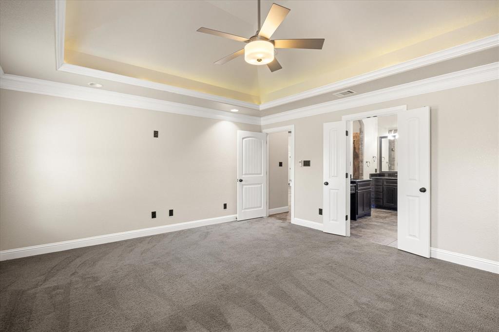 3711 Lonesome Creek Road Granbury, TX 76049 - Photo 15 of 39 Owners suite leading to a spacious ensuite bath.