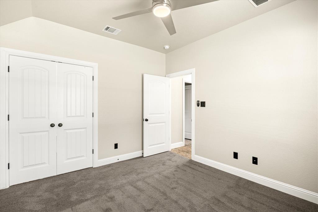 3711 Lonesome Creek Road Granbury, TX 76049 - Photo 22 of 39 Front of home secondary bedroom with large walk in closet