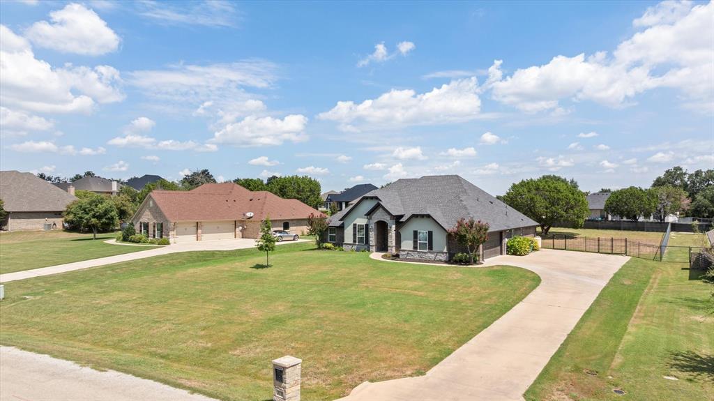 3711 Lonesome Creek Road Granbury, TX 76049 - Photo 3 of 39 Driveway set up offers tons of parking as well as, with HOA approval, access to a future shop or pool house in the backyard.