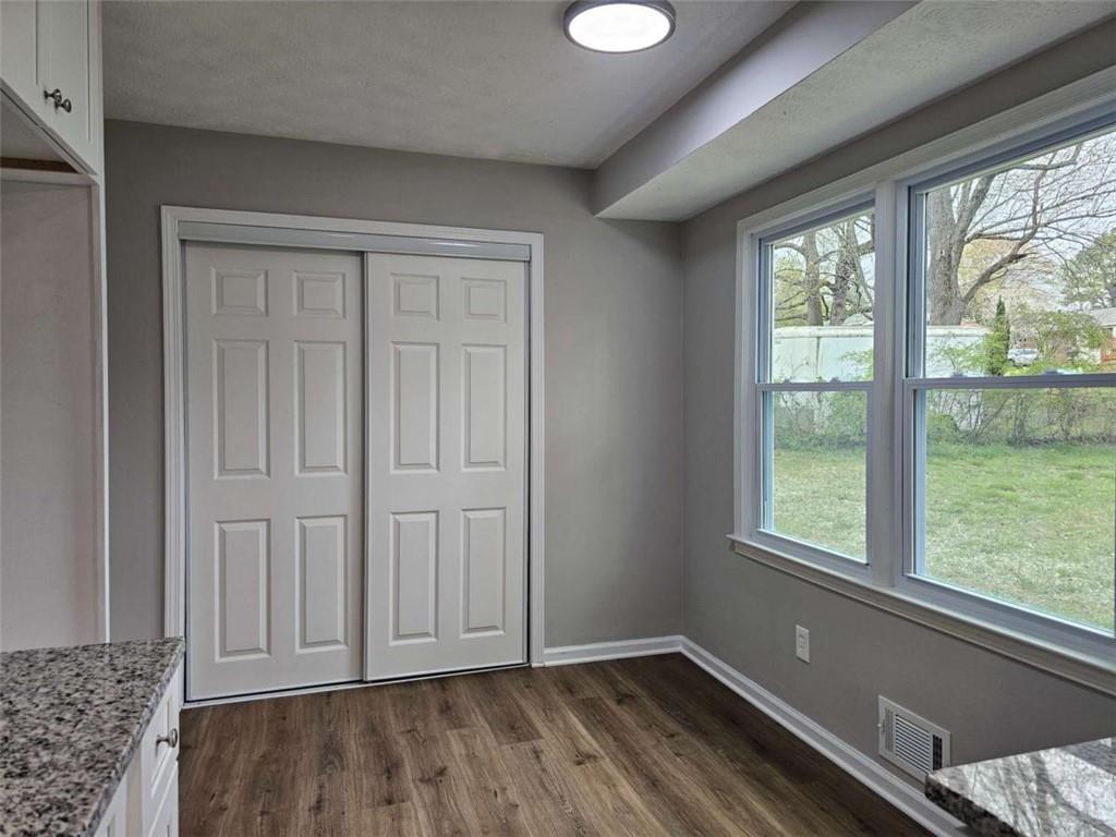 6470 Michell Way Douglasville, GA 30135 - Photo 16 of 41 an empty room with wooden floor and windows