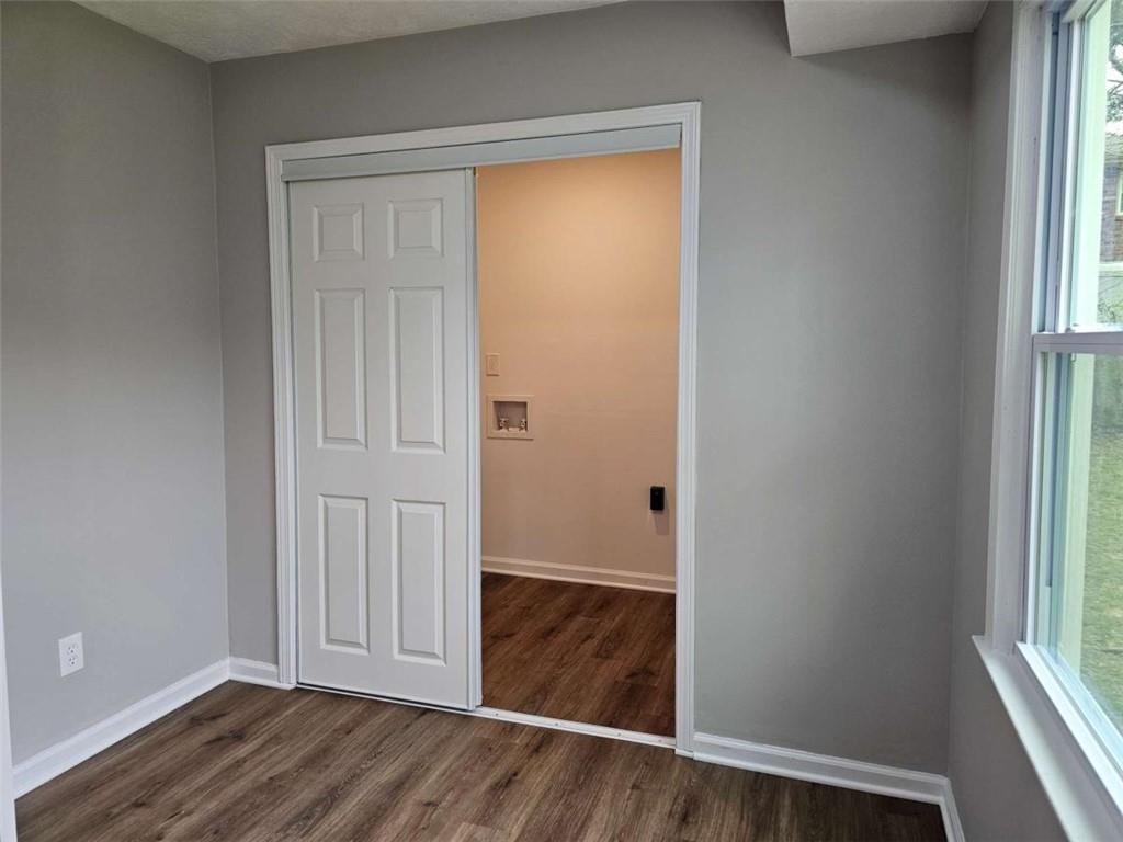 6470 Michell Way Douglasville, GA 30135 - Photo 17 of 41 an empty room with wooden floor and windows