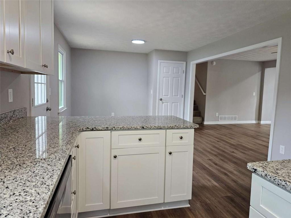 6470 Michell Way Douglasville, GA 30135 - Photo 18 of 41 a bathroom with a granite countertop sink and a mirror