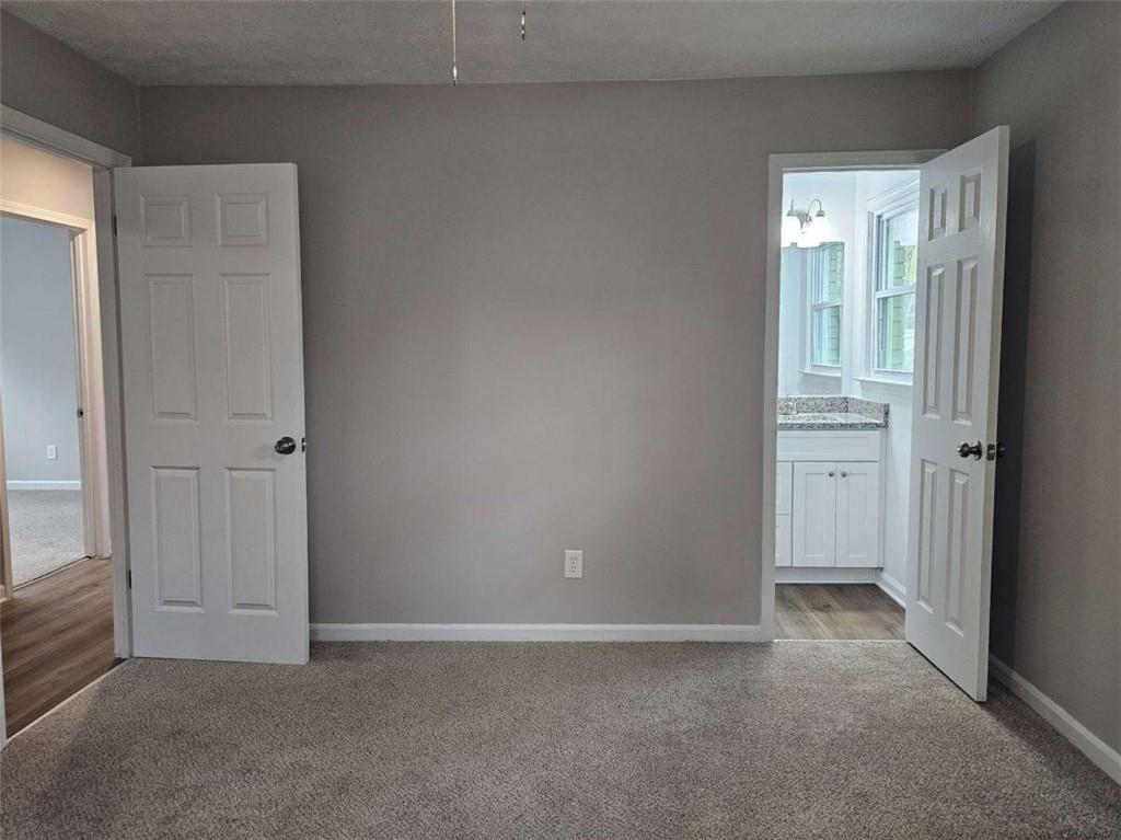 6470 Michell Way Douglasville, GA 30135 - Photo 23 of 41 an empty room with windows