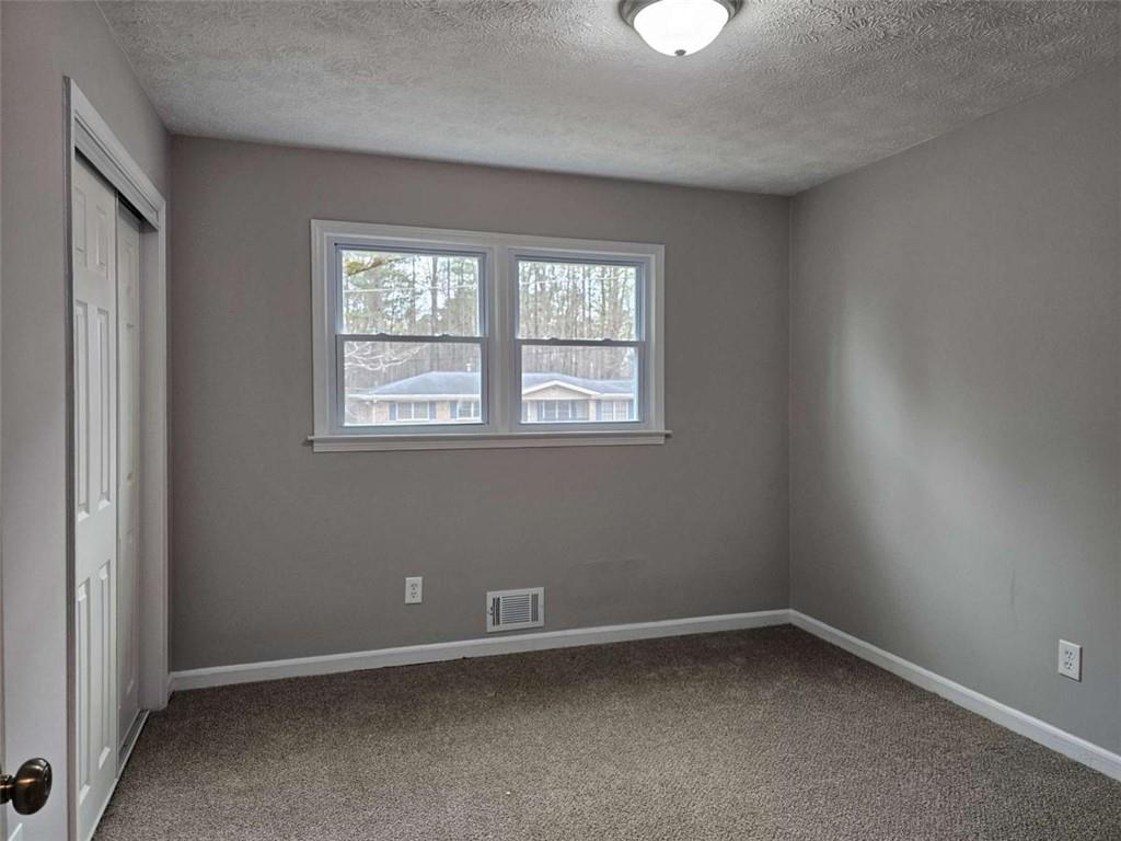6470 Michell Way Douglasville, GA 30135 - Photo 28 of 41 an empty room with a window