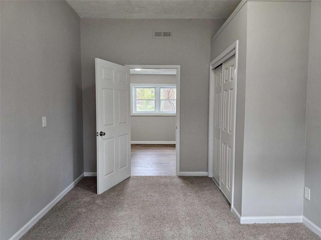 6470 Michell Way Douglasville, GA 30135 - Photo 34 of 41 an empty room with windows