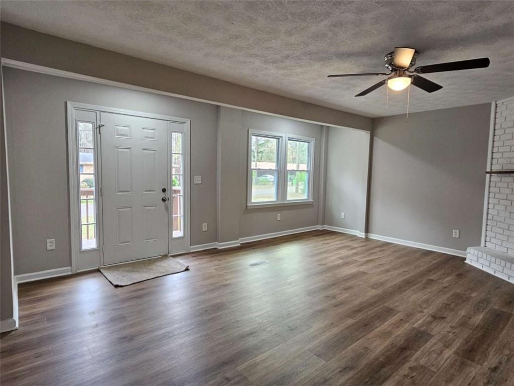 6470 Michell Way Douglasville, GA 30135 - Photo 4 of 41 a view of an empty room with wooden floor and a window